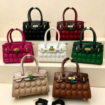 Buttons in front lady handbag rough material A25881