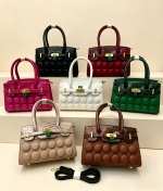 Buttons in front lady handbag rough material A25881
