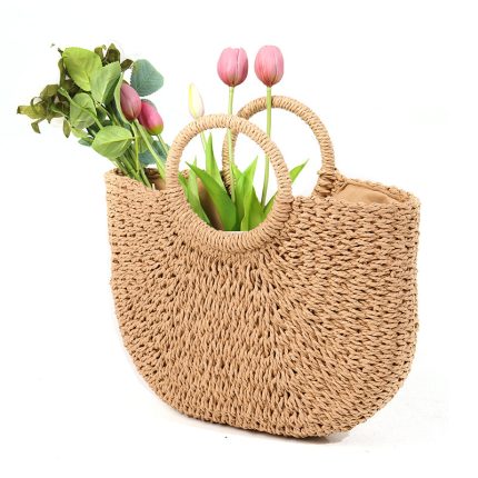 Half-round handbag made of woven grass with a beachy style