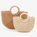Half-round handbag made of woven grass with a beachy style