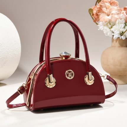 Clasp handbag with luxurious shiny material