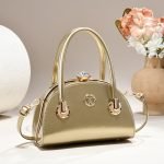Clasp handbag with luxurious shiny material - Image 3