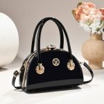 Clasp handbag with luxurious shiny material - Image 2