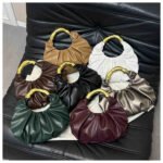 Fashion handbag with pleated design